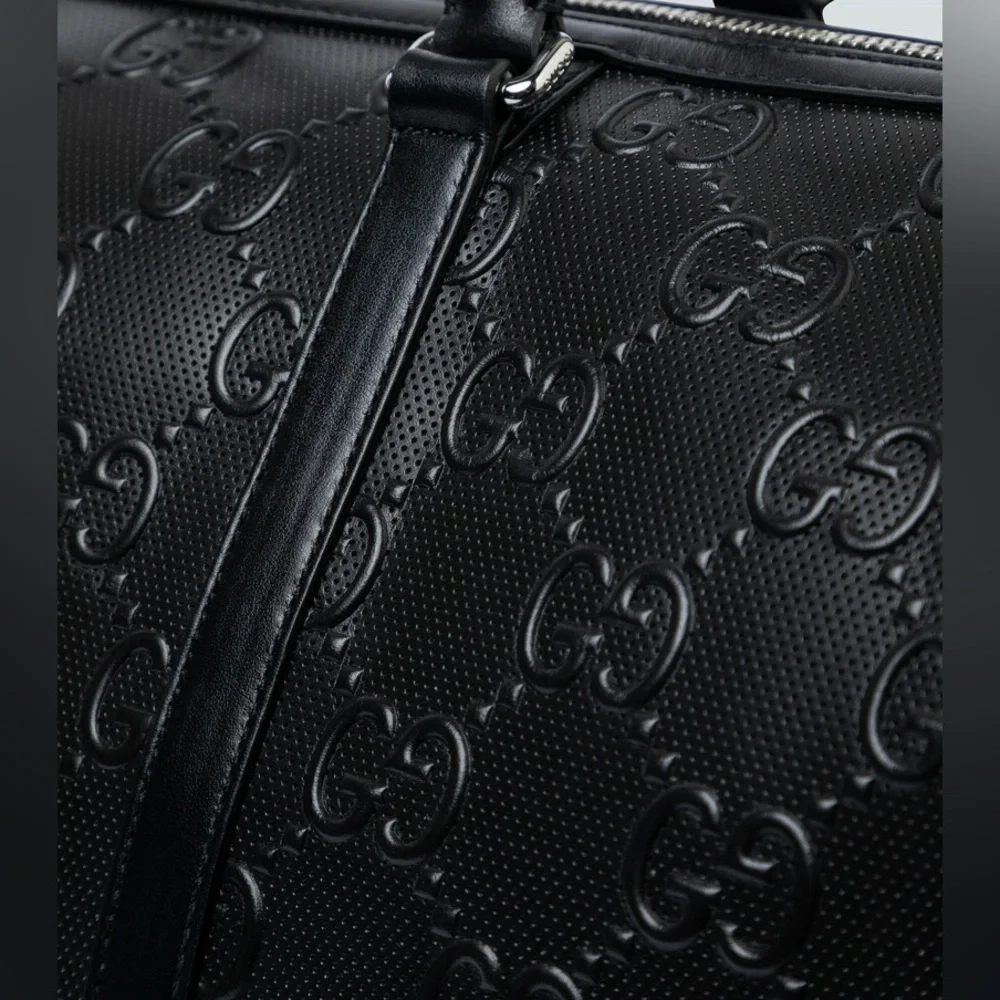 New! Gucci GG embossed black leather duffel bag